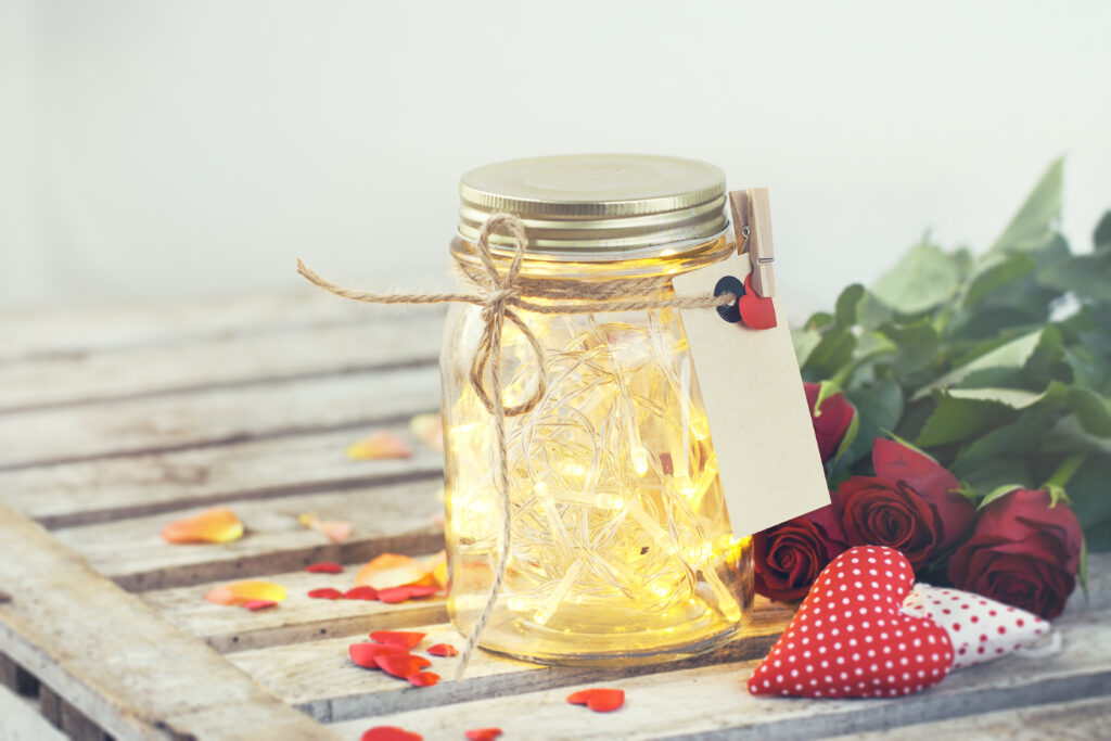 glass jar with lightsand rope scale